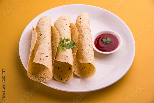 rosted papad or roll papad, indian traditional started food or side dish photo