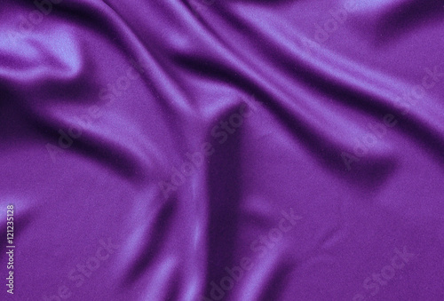 Texture satin. silk background. shiny wavy pattern canvas. color fabric, cloth purple