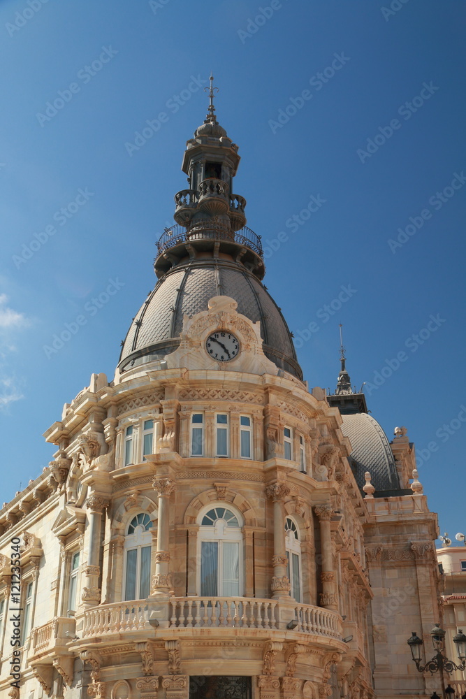 Beautiful facade of the City Hall of Cartagena, Spain, with bell and clock