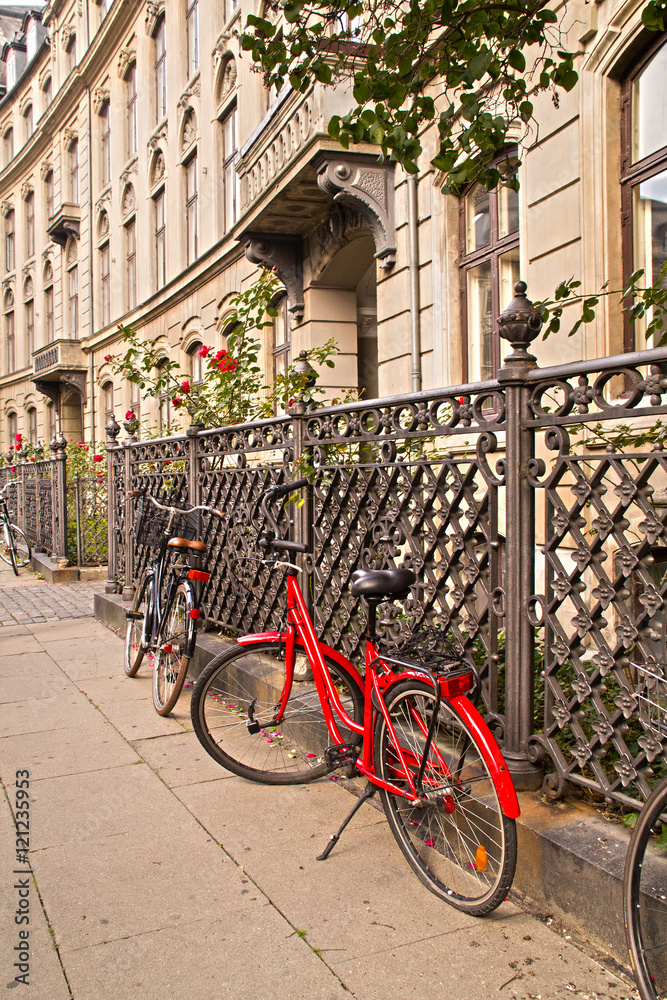 Parked Bicycles On Sidewalk in historic part of Copenhagen, Denmark