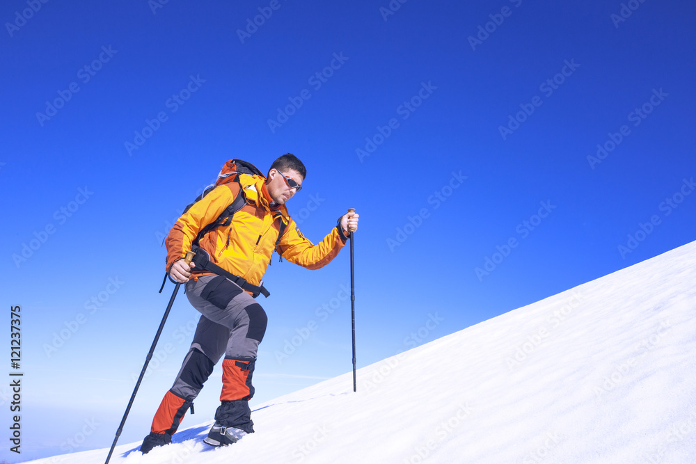 Winter hiking in the mountains with a backpack. Winter hiking in the mountains with a backpack.