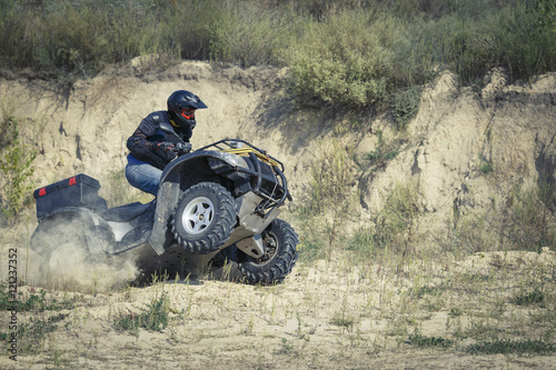 Racing atv is sand.