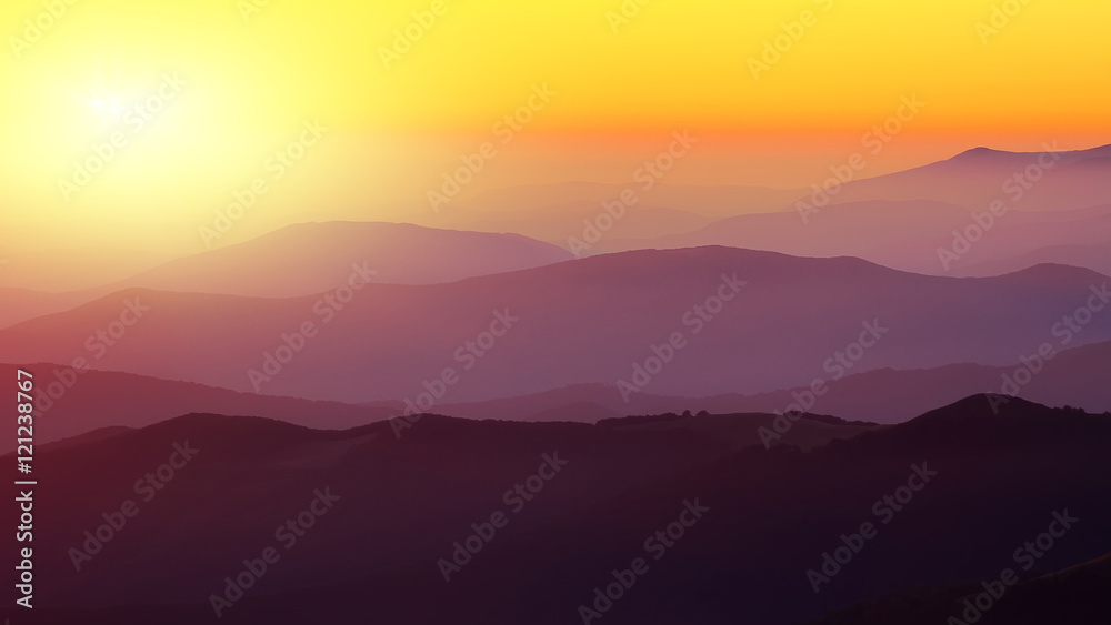Silhouettes of the mountain hills at sunset