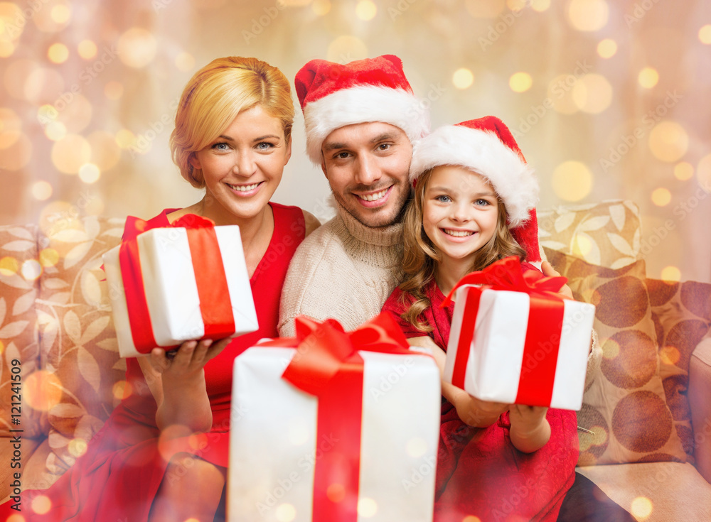 smiling family giving many gift boxes smiling family giving many gift boxes