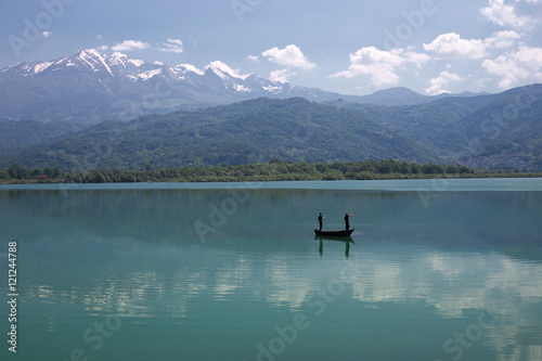 Fishermen on Fishing Boat in the Lake - Landscape © tanja_g