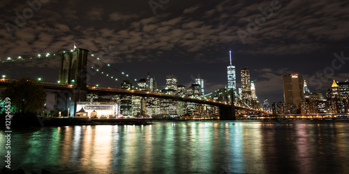Brooklyn Bridge in front of Manhattan at night © Asvolas