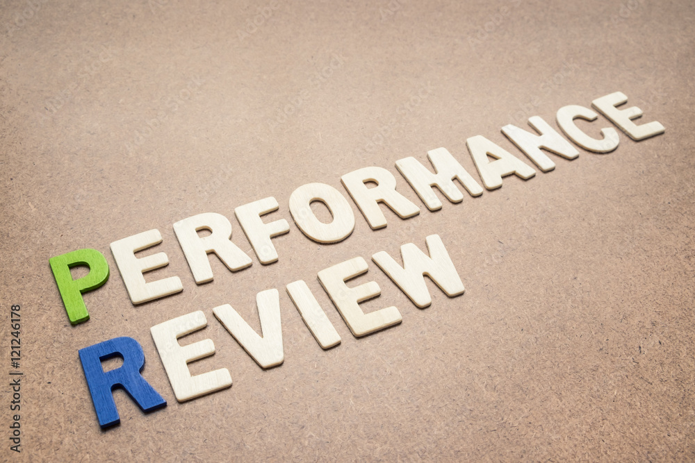 Performance review text on brown background