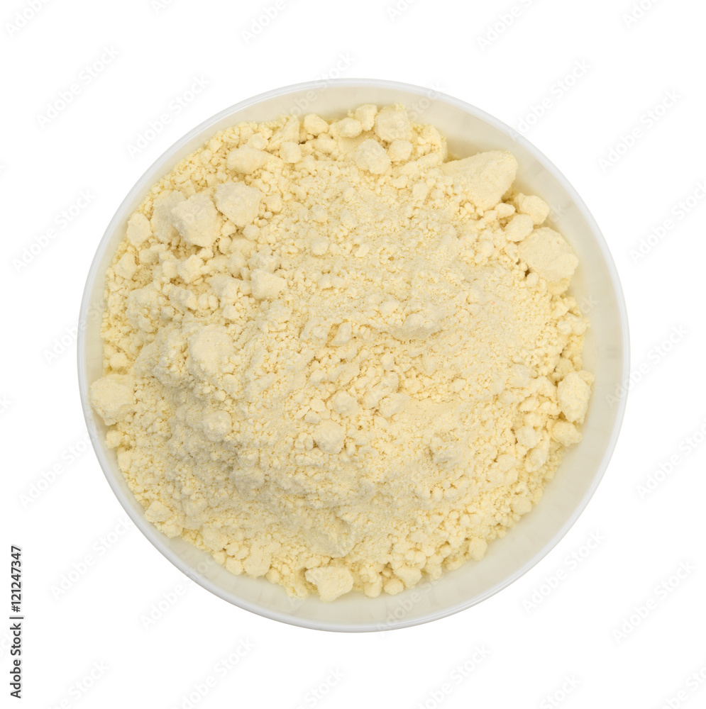 French vanilla cake mix top view in bowl on a white background. French vanilla cake mix top view in bowl on a white background.