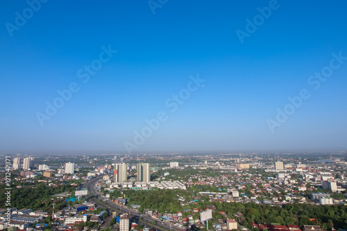Clear blue sky as a background wallpaper, pastel sky wallpaper, with city scape © bookybuggy