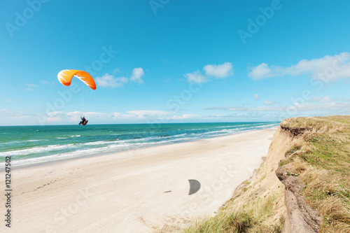 Paragliding on the deserted beach