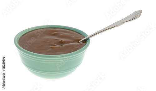 Mushroom soup with beef chunks in a bowl side view isolated on a white background.