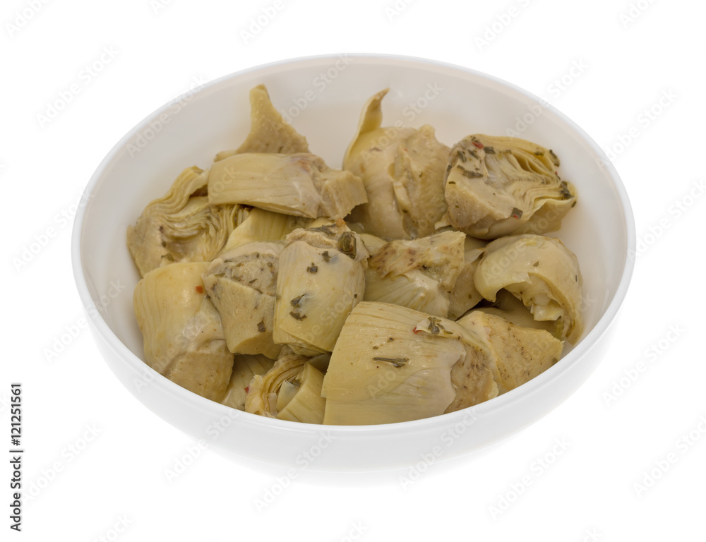 Marinated artichoke hearts in bowl side view isolated on a white background. Marinated artichoke hearts in bowl side view isolated on a white background.