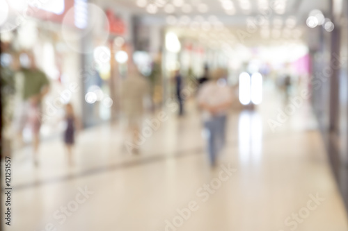 Blur store with bokeh background. Silhouettes of Business People