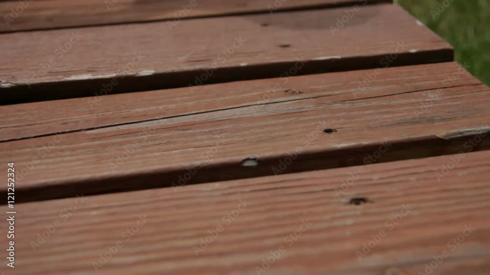 Close-up dolly of an old wooden deck. Close-up dolly of an old wooden deck.