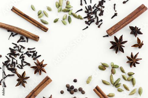Spices for mulled wine on white background