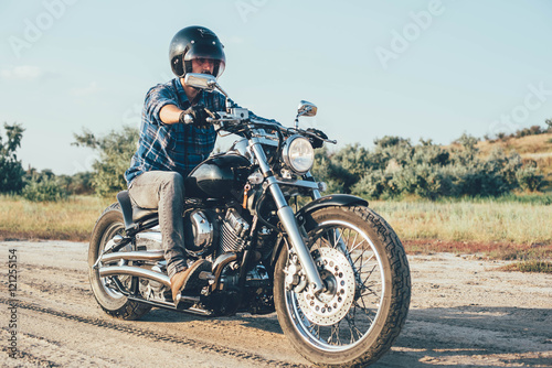 Fototapeta Naklejka Na Ścianę i Meble -  man riding motorcycle