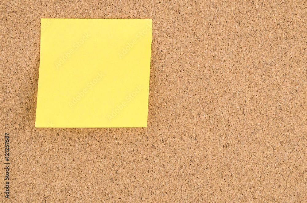 Cork Noticeboard with a Blank Sticky Note Cork Noticeboard with a Blank Sticky Note