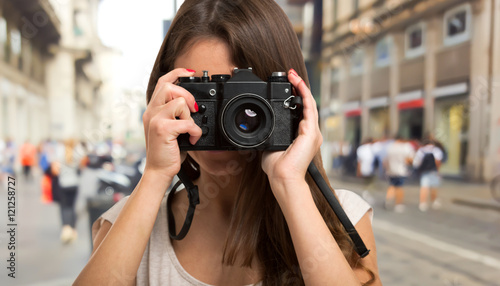 Female photographer using a camera