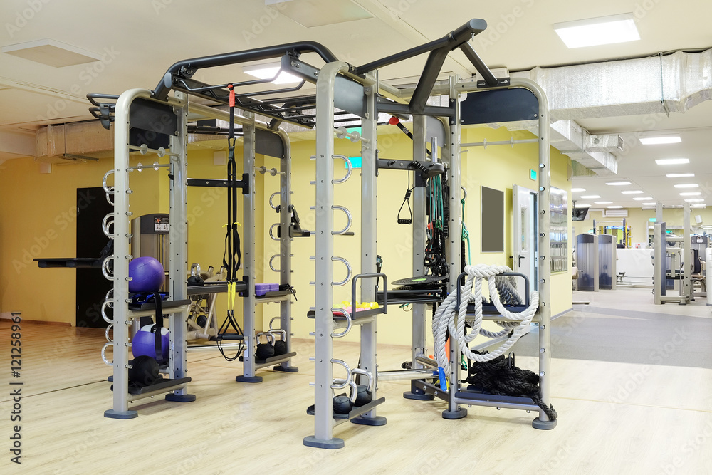Fototapeta premium Interior of a fitness hall with sport equipment