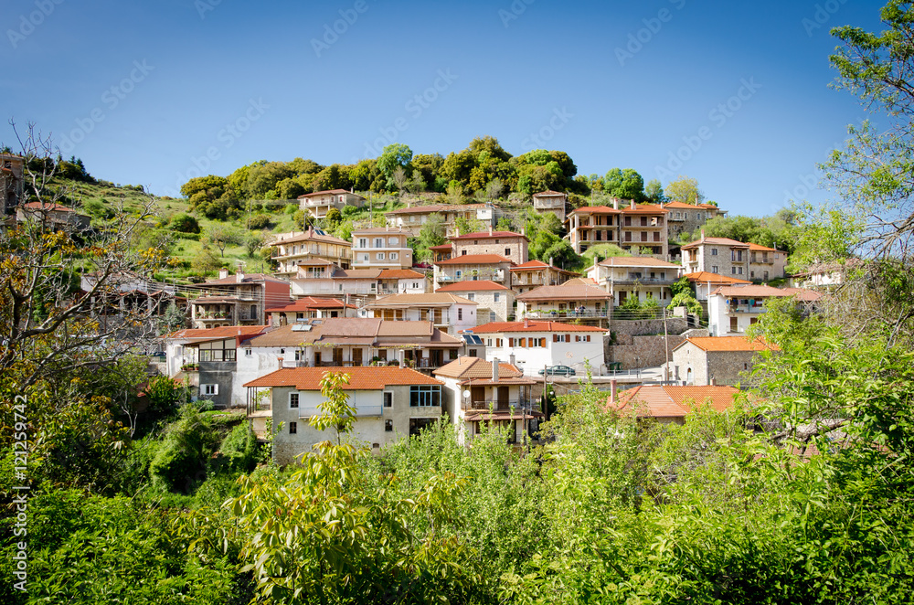 House and cemetery on the top of the hill, Baltessiniko village. Arcadia, Peloponnese,Greece