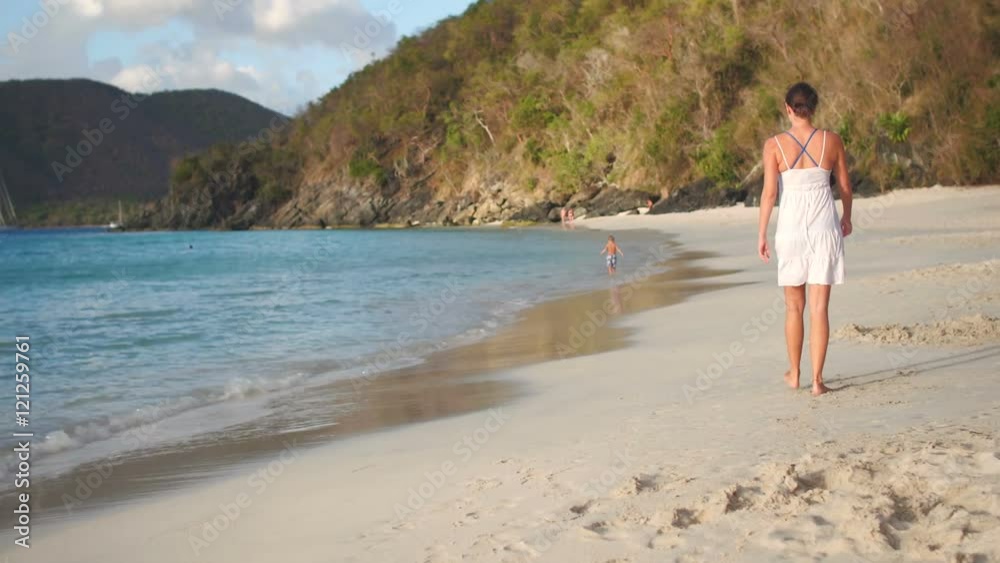 mother and child walking on a beach, Cinnamon Bay, St John, United States Virgin Islands mother and child walking on a beach, Cinnamon Bay, St John, United States Virgin Islands