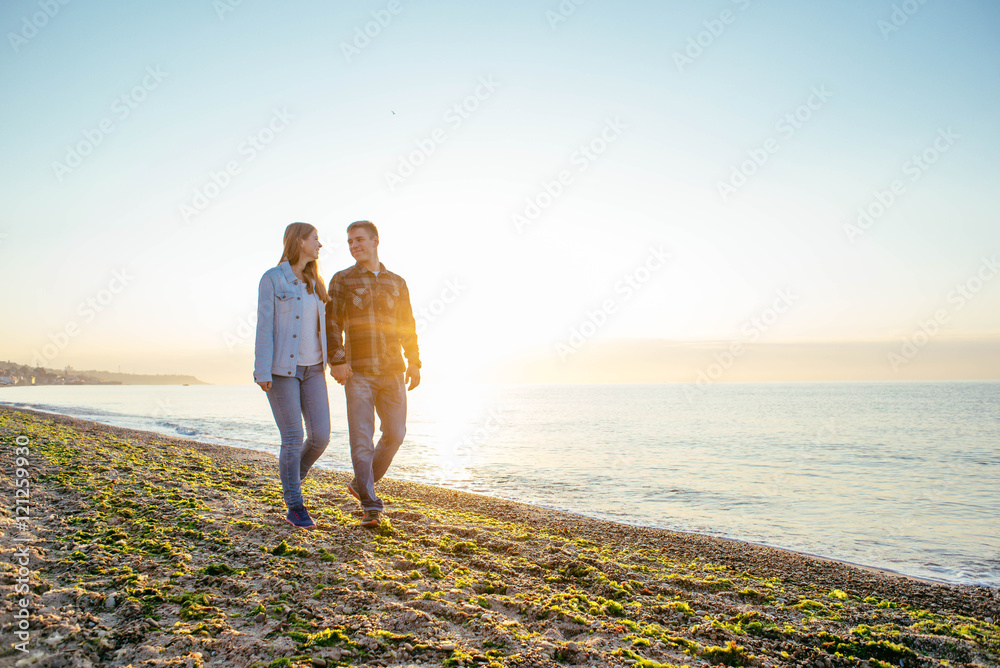 young loving couple having fun on beach