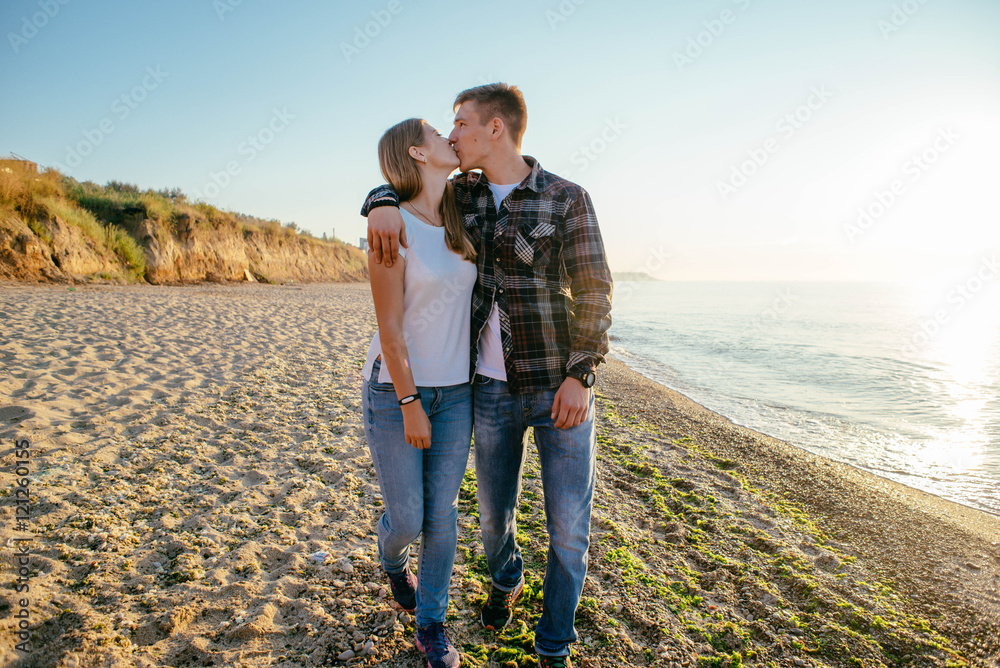 young loving couple walking on beach young loving couple walking on beach