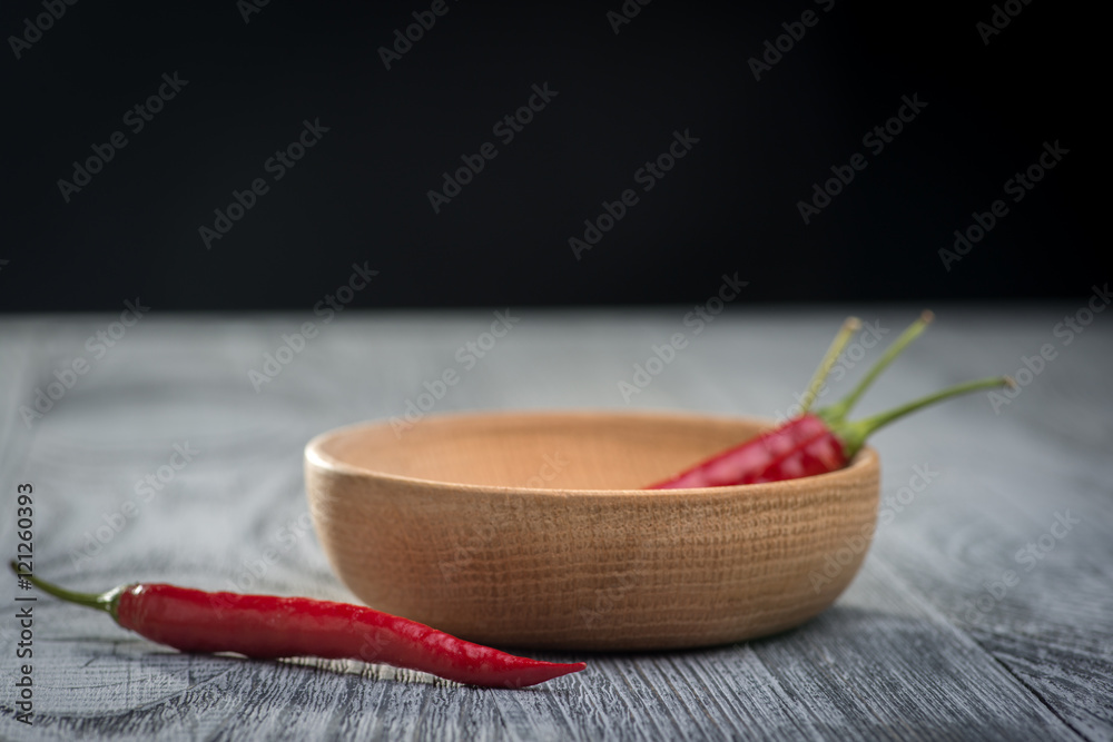 Chili peppers on the table with a black background