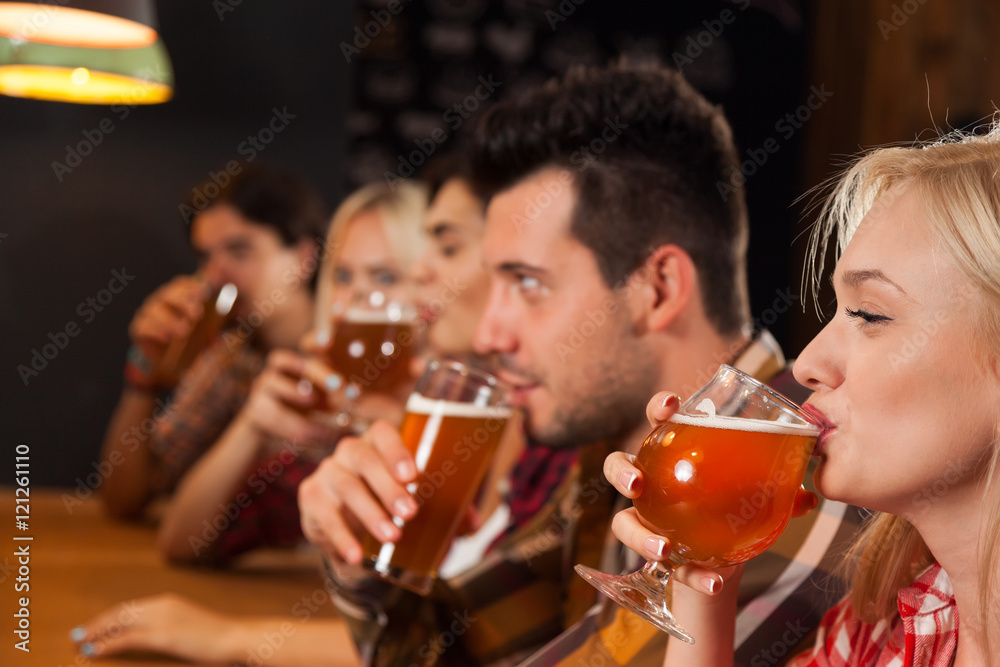 Young People Group In Bar, Drink Beer Hold Glasses, Friends Sitting At Wooden Table Pub