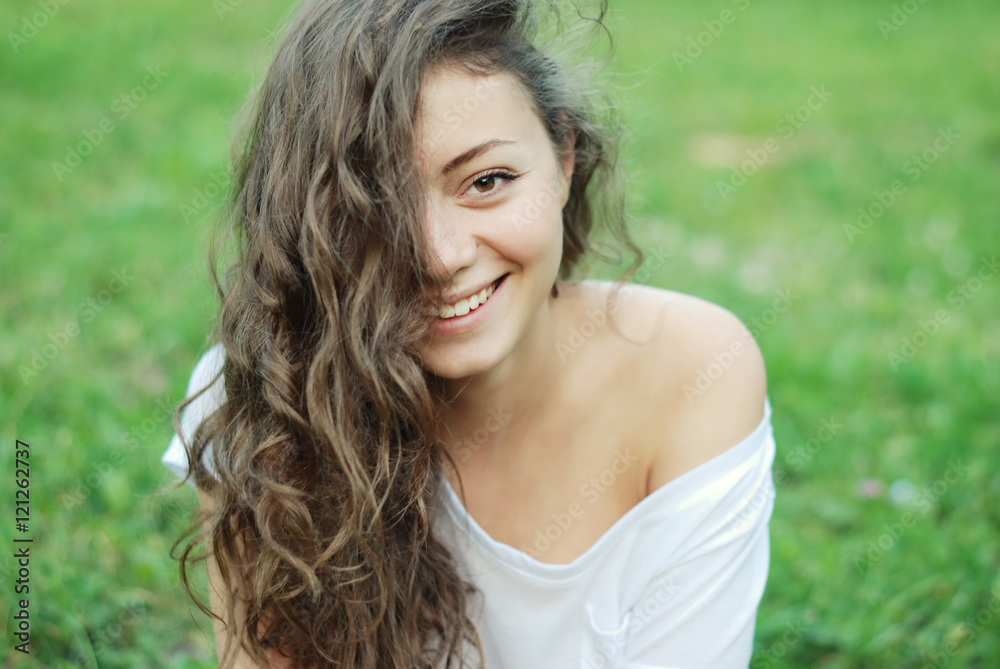 Beautiful girl with long wavy hair . Brunette with curly hairstyle Beautiful girl with long wavy hair . Brunette with curly hairstyle
