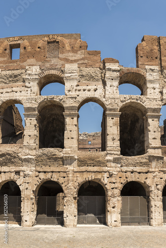 A cropped view of the outside wall of the Colosseum, in Rome, Italy