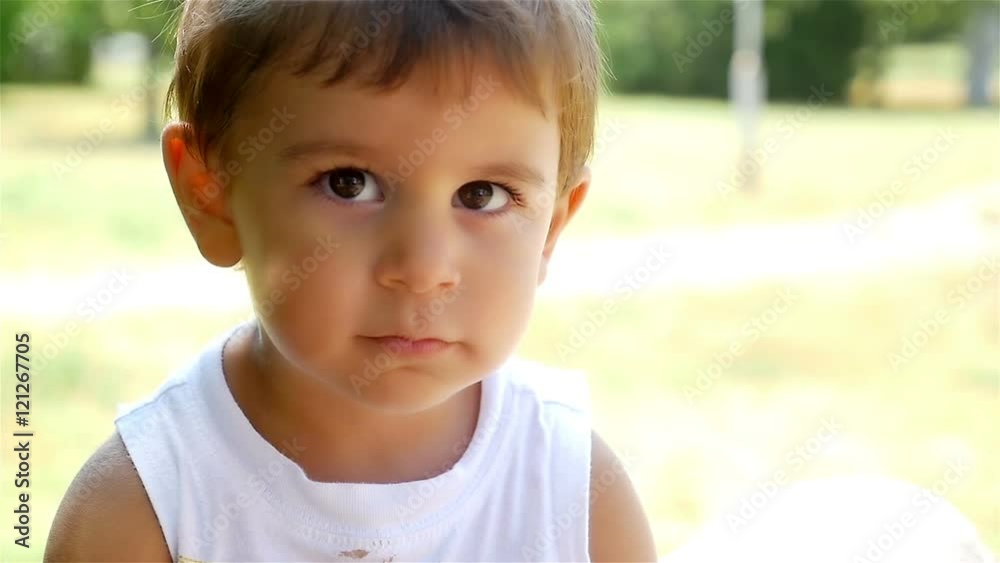 Close portrait of a cute little boy giving a kiss, slow motion Close portrait of a cute little boy giving a kiss, slow motion