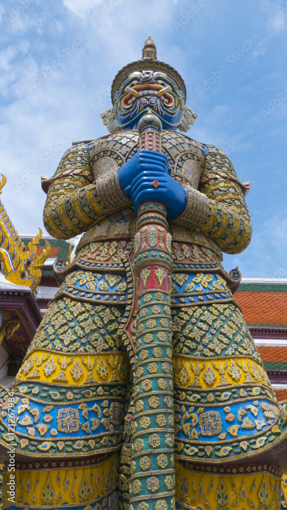 The beautiful of  giant smile statue of the Emerald Buddha temple(Wat phra kaew) and Royal Grand Palace ,Bangkok,Thailand.