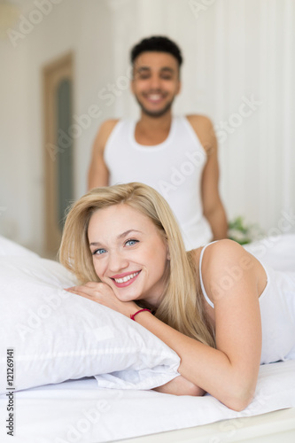 Young Couple Lying In Bed, Happy Smile Hispanic Man And Woman