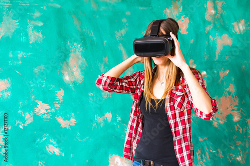 Young woman using the virtual reality headset © satura_