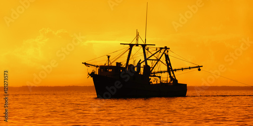 Fishing boat at Dusk Trinidad and Tobago Gulf of Paria leasure and recreation pursuit