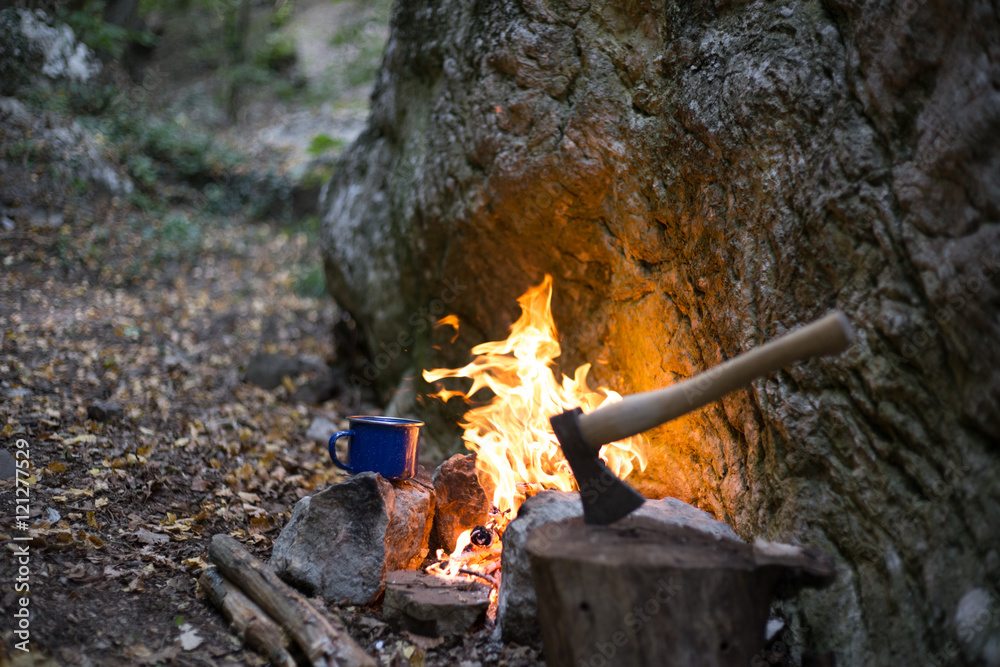 Cooking breakfast on a campfire at a summer camp. Cooking breakfast on a campfire at a summer camp.