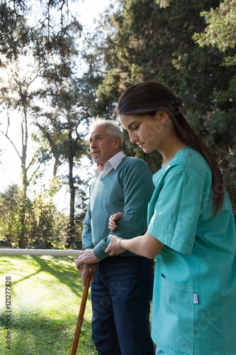 nurse helping a elder man