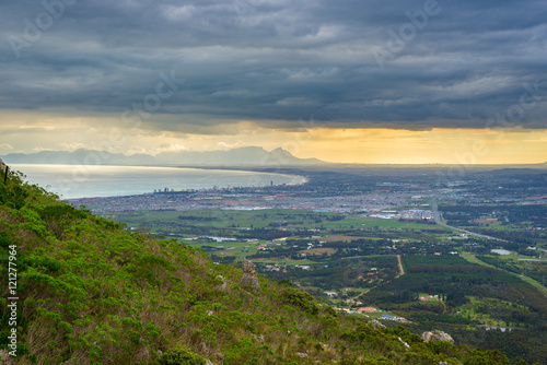 Aerial view of Cape Town from Sir Lowry's Pass, South Africa. Winter season, cloudy and dramatic sky.
