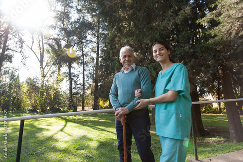 nurse helping a elder man