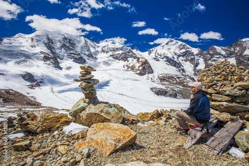 Young man enjoying the stunning view of Morteratsch glacier