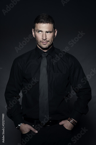 young business man in studio in black shirt