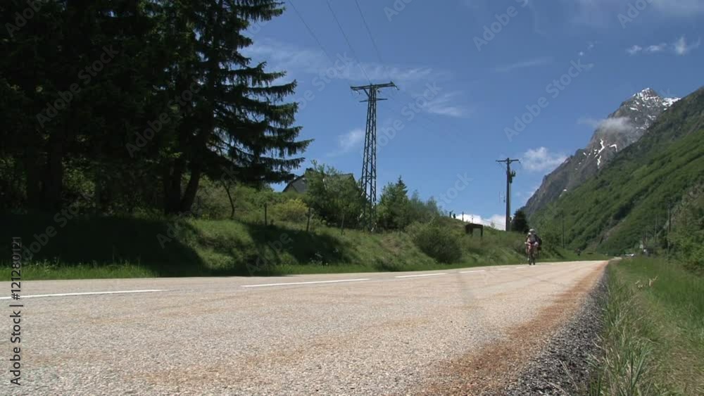 Cycling with bike and tandem go down in the French Alps, Col d'Ornon, France Cycling with bike and tandem go down in the French Alps, Col d'Ornon, France