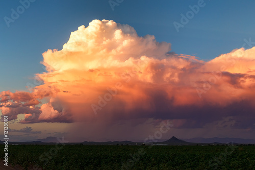 Colorful sky at sunset with cumulonimbus storm clouds