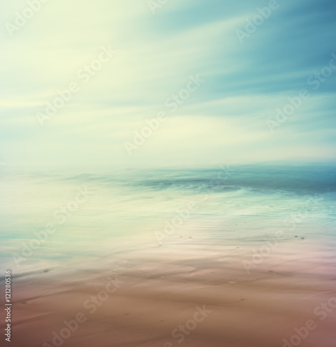 Cross-Processed Sea and Sand. An abstract, time-exposure seascape with panning movement.  Image displays a retro, vintage look with cross-processed colors.