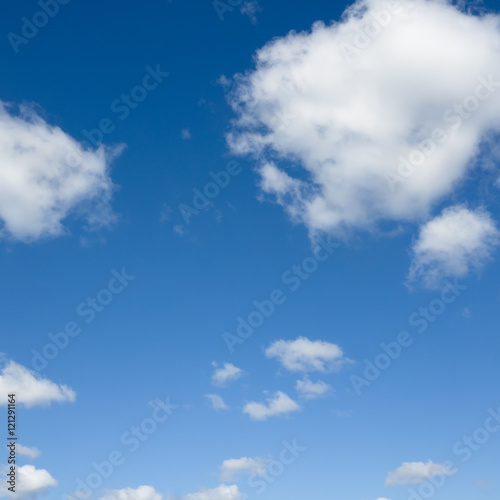 White clouds flying again blue sky.