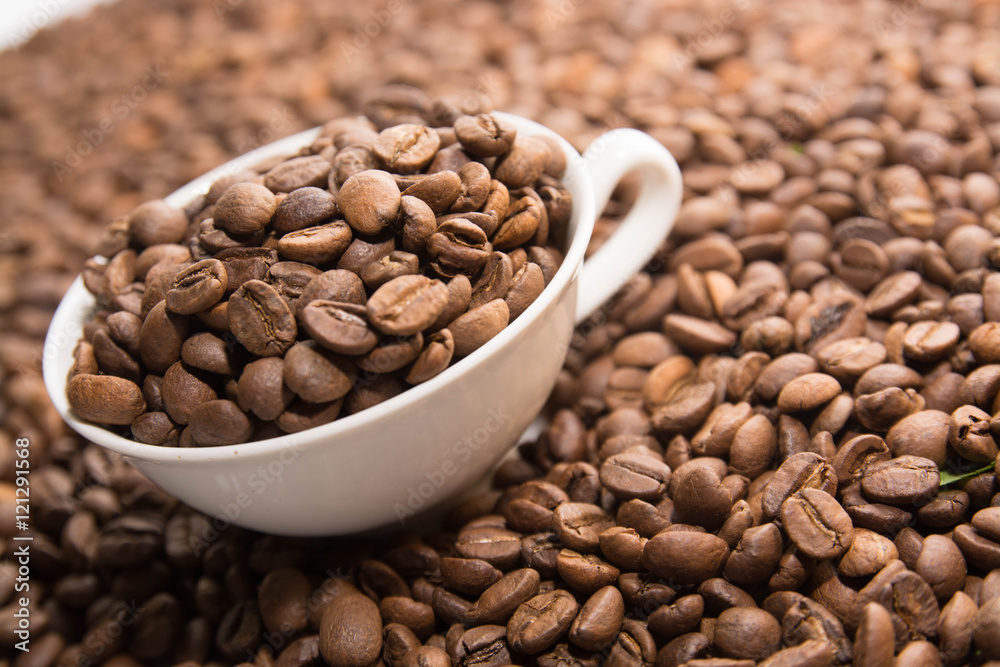 Fototapeta premium Cup with Beans on White Background