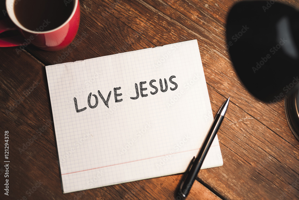 Love Jesus text on notebook Love Jesus text on notebook