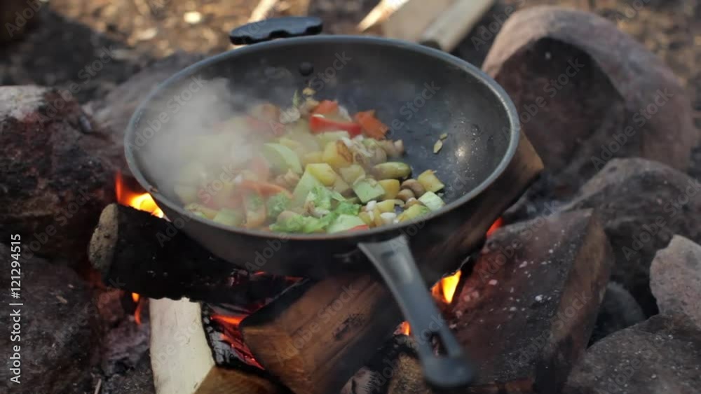 Vegetarian Stew Prepared on a Large Frying Pan Over a Fire Vegetarian Stew Prepared on a Large Frying Pan Over a Fire