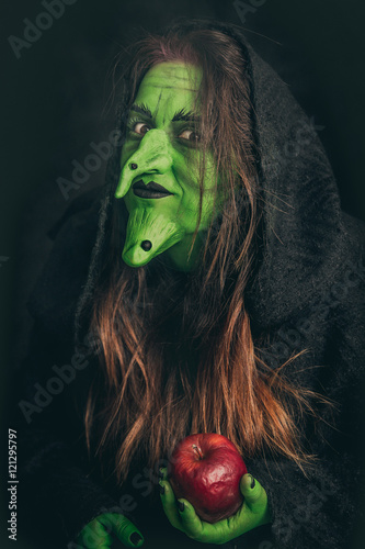 Wallpaper Mural Evil witch holding a rotten apple Torontodigital.ca